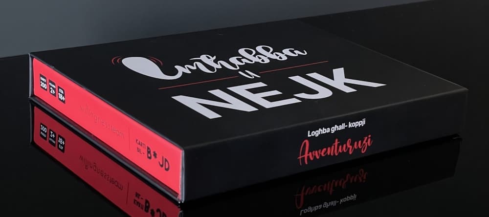 The Imħabba u Nejk card game box and cards laid out on a table